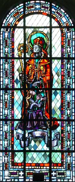 Saint-Florent avec crosse et la fille de Dagobert II (à qui il a rendu la vue et l'ouie) agenouillée à ses pieds